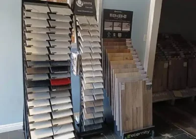 Flooring sample displays in a store with a variety of stone and wood options