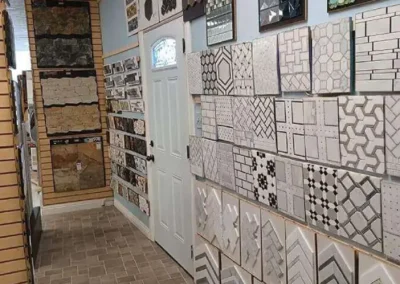 Interior of a tile shop showcasing various styles of wall and floor tiles on display
